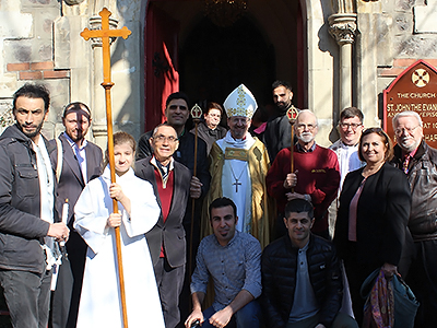 Bishop Robert surrounded by the newly baptized and Turkish Church Wardens.