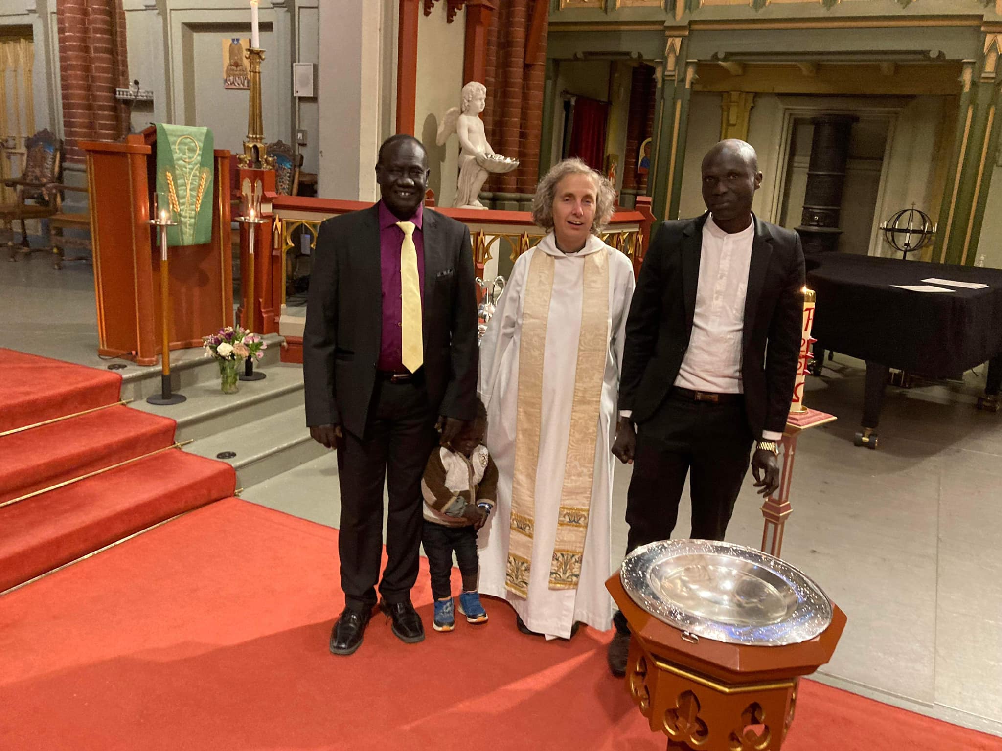 Three men after a baptism.