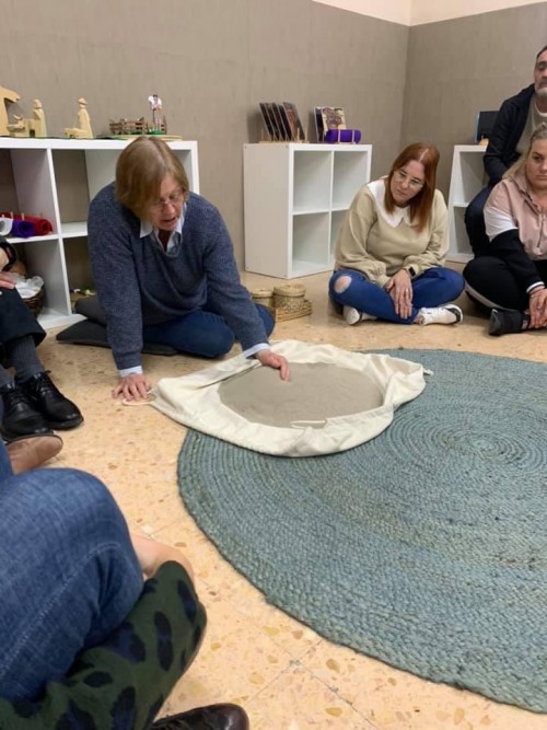 A photo of Celia Paterson teaching a group.