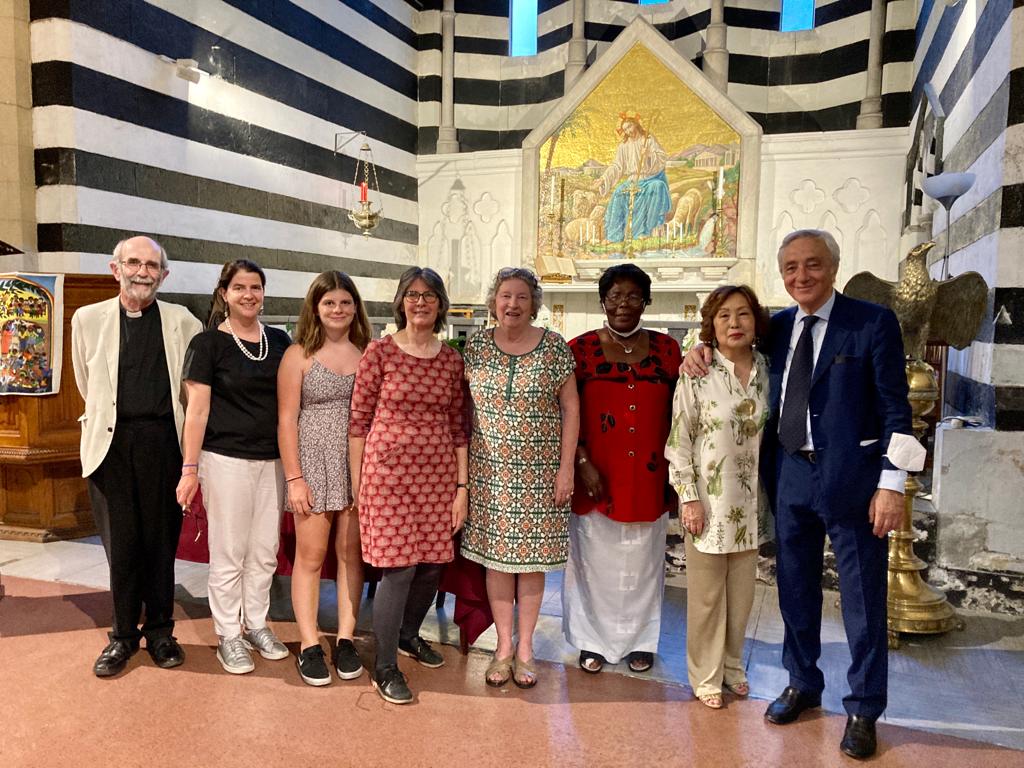 A group posing for a photograph in a church.