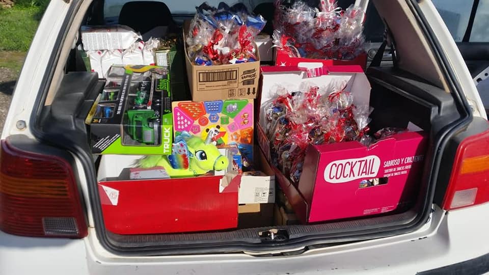 A car boot full of sweets and toys.