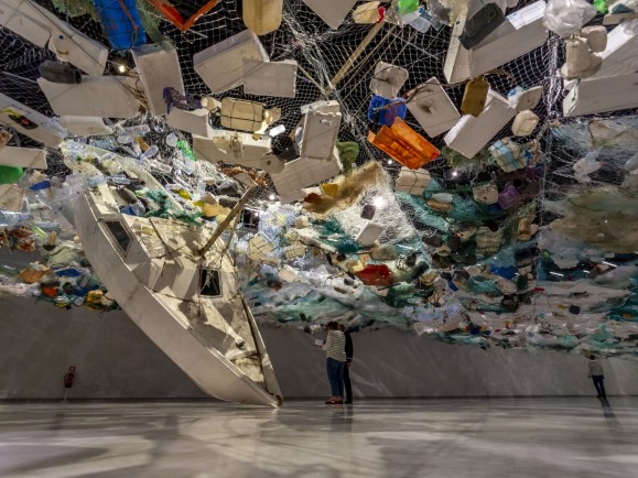 A sinking ship made up of recycled rubbish.