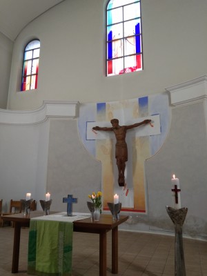 A wooden jesus on the cross.