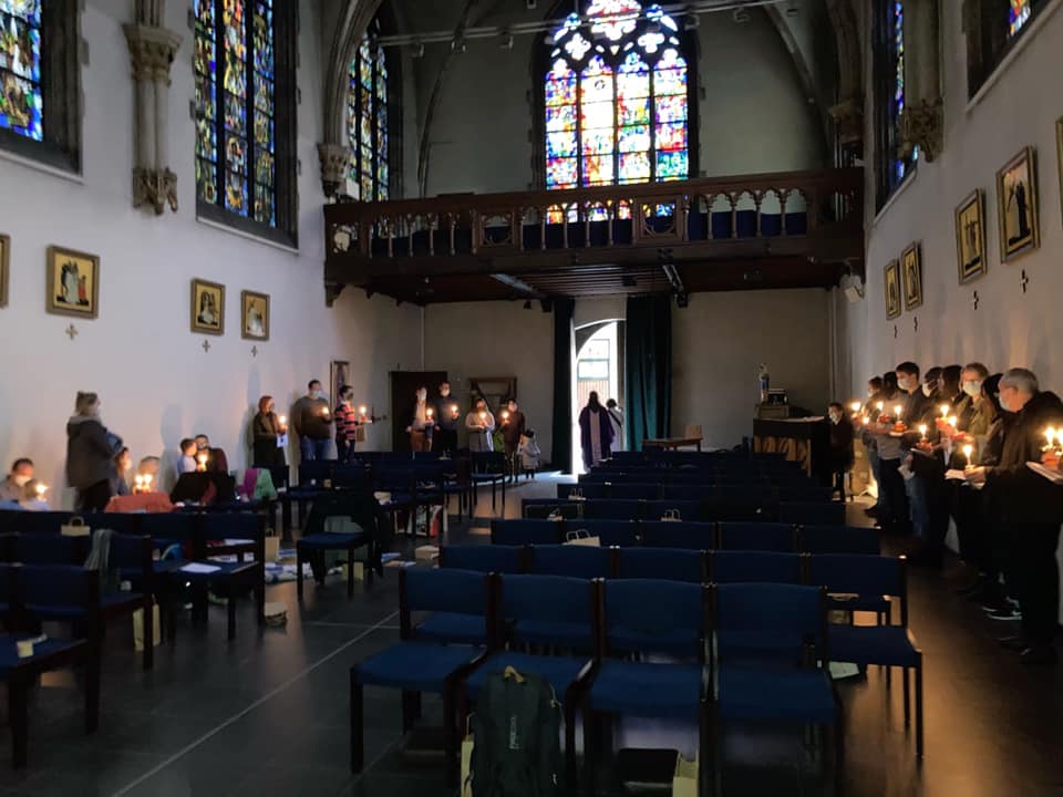 A chaplaincy lit by candle light.