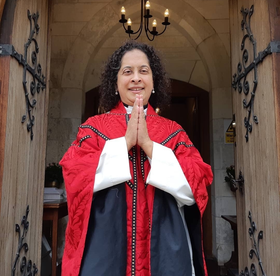 Revd Canon Smitha smiling for the camera.