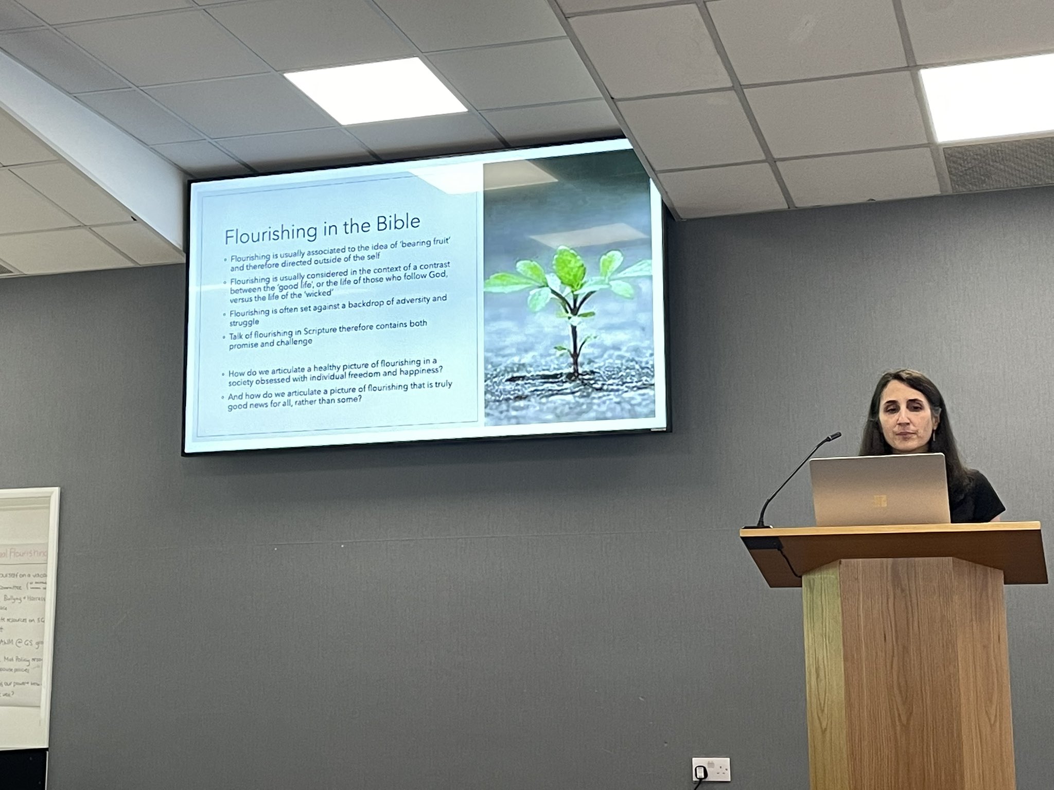 A woman giving a talk on womens ministry.