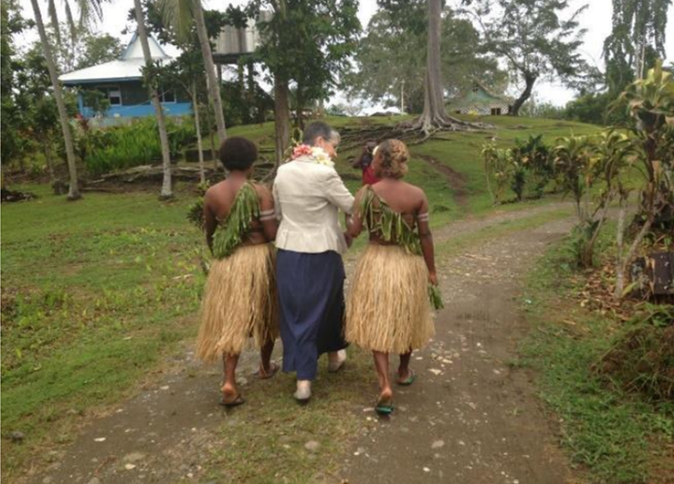 Three women walking together in Tanzania.
