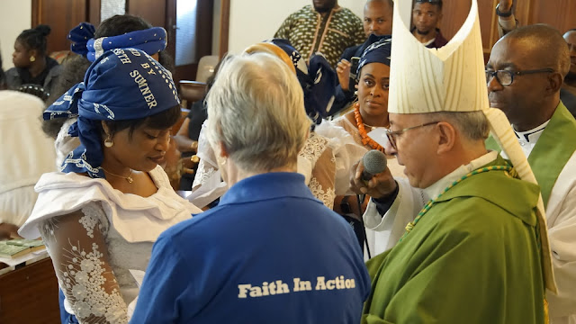 Bishop David admitting members of the Mothers Union.