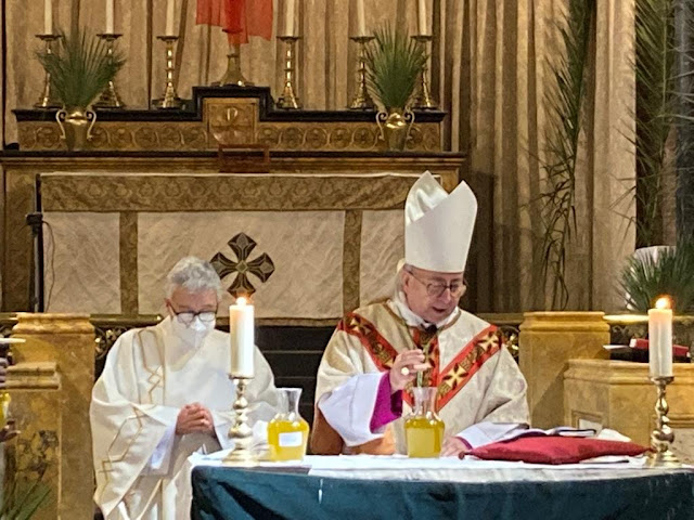 Bishop David blessing the oils.