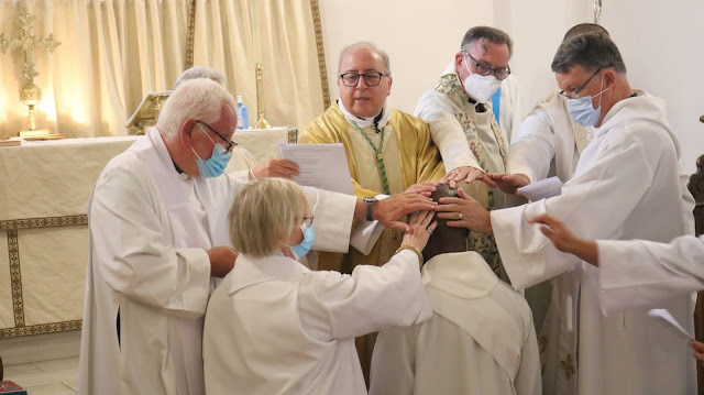 Father Solomon Ike being ordained.