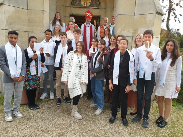 Bishop Robert and a group of young French Christians.