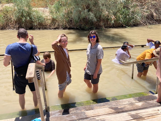 The group paddling in a river.