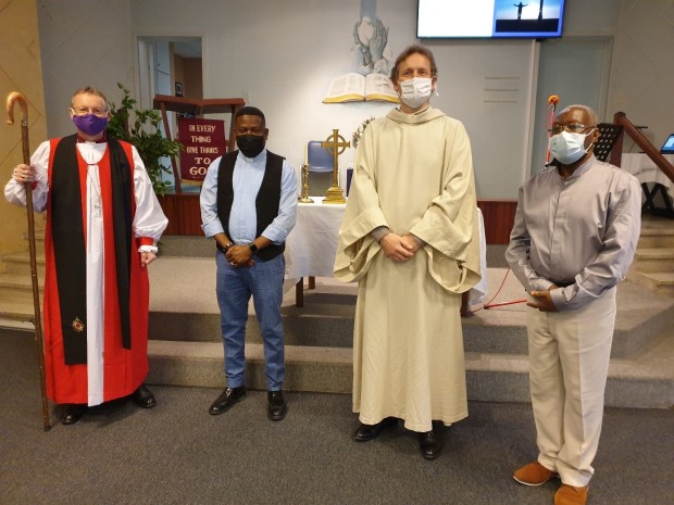 Bishop Robert with Canon Jack McDonald, second from right, next to James the usher.