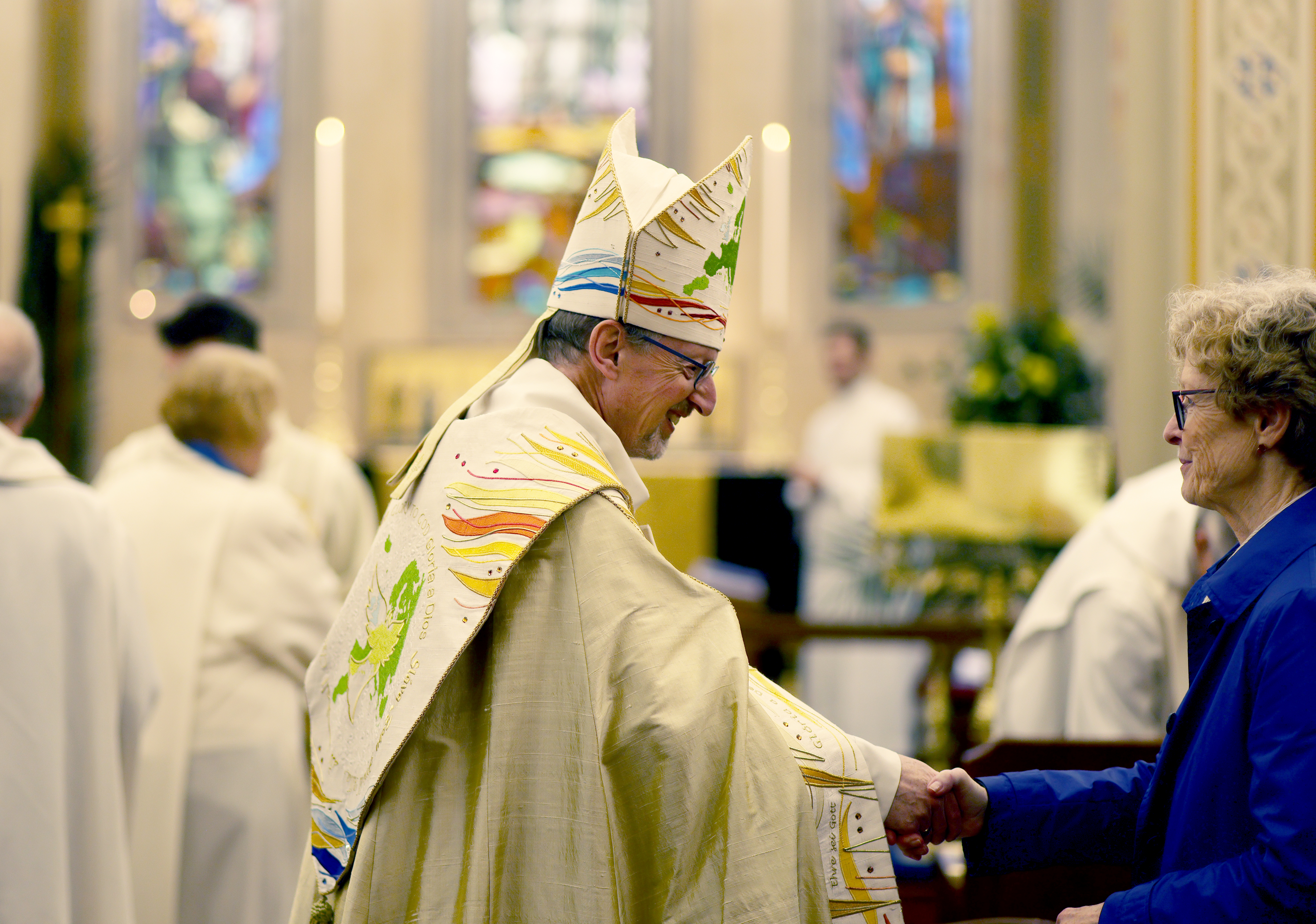 Bishop Robert greeting a member of the congregation