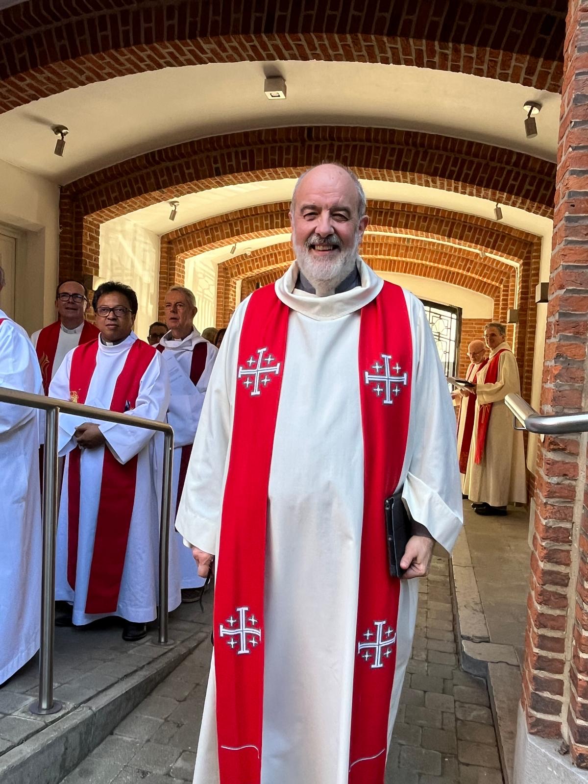 Rev Canon John Wilkinson looks to camera in his vestments