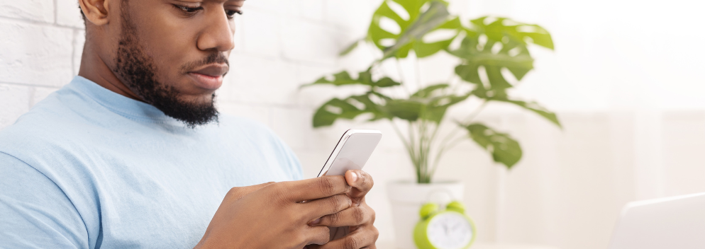 man looking at phone