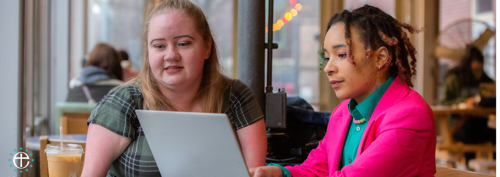 two girls on a laptop