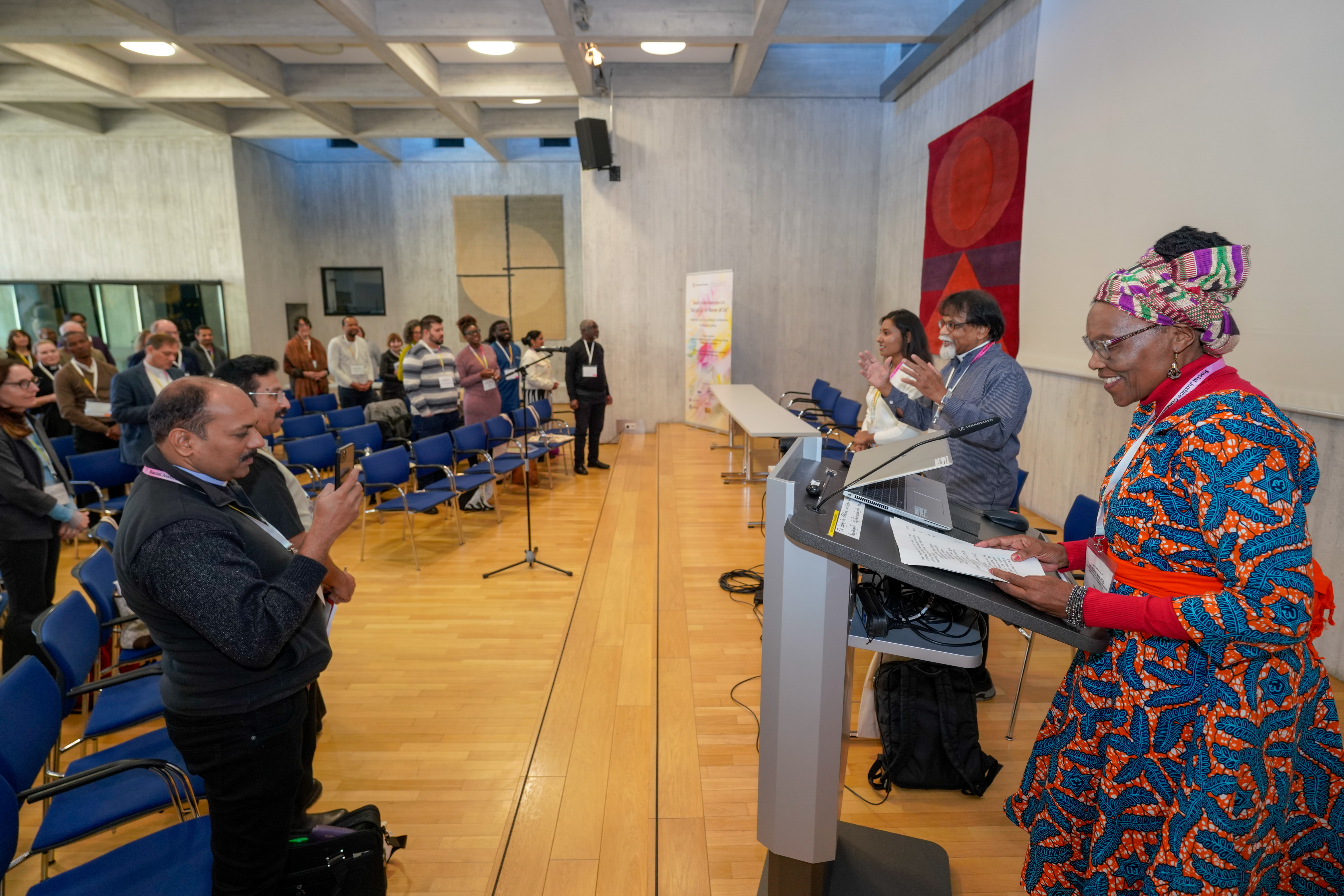 a lady speaks at a conference
