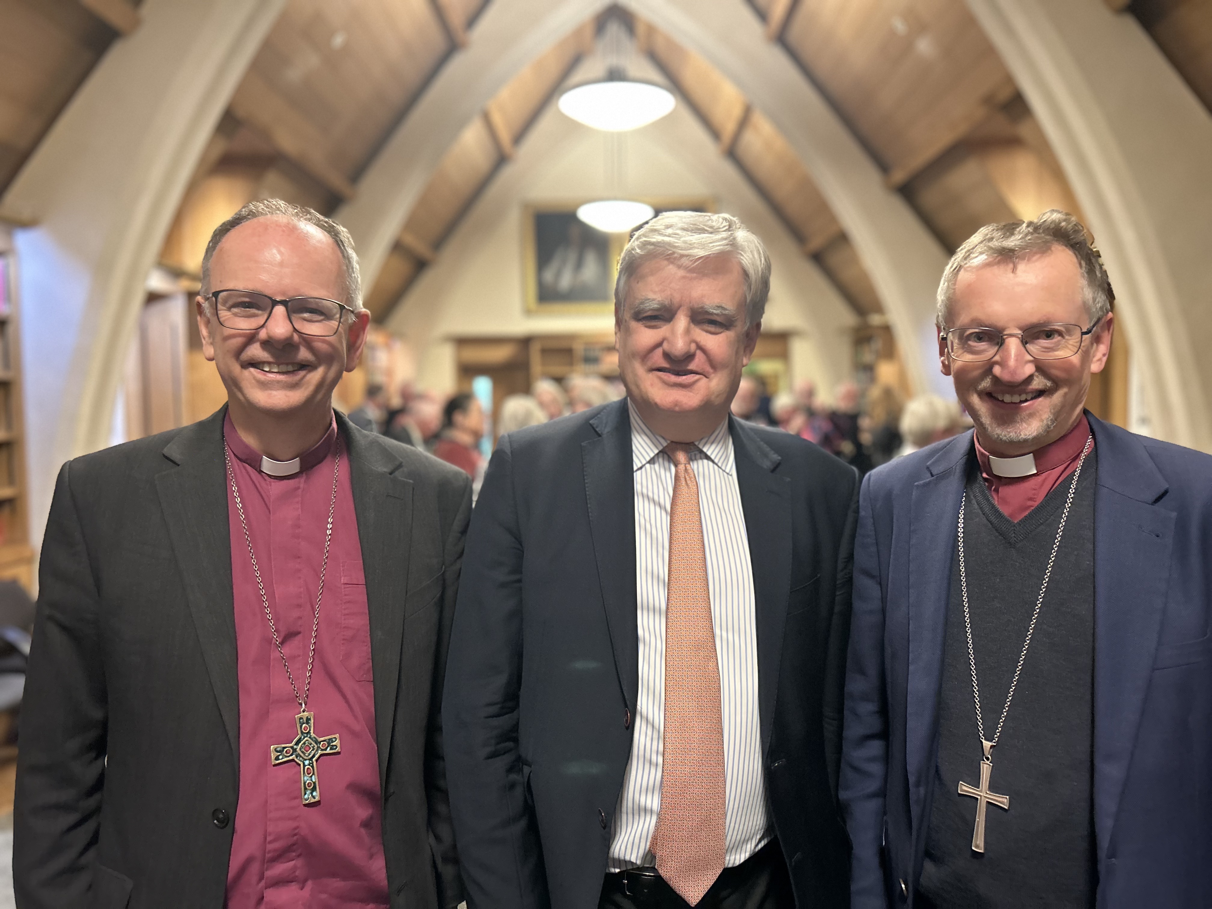 3 men smile to camera 2 of which are bishops