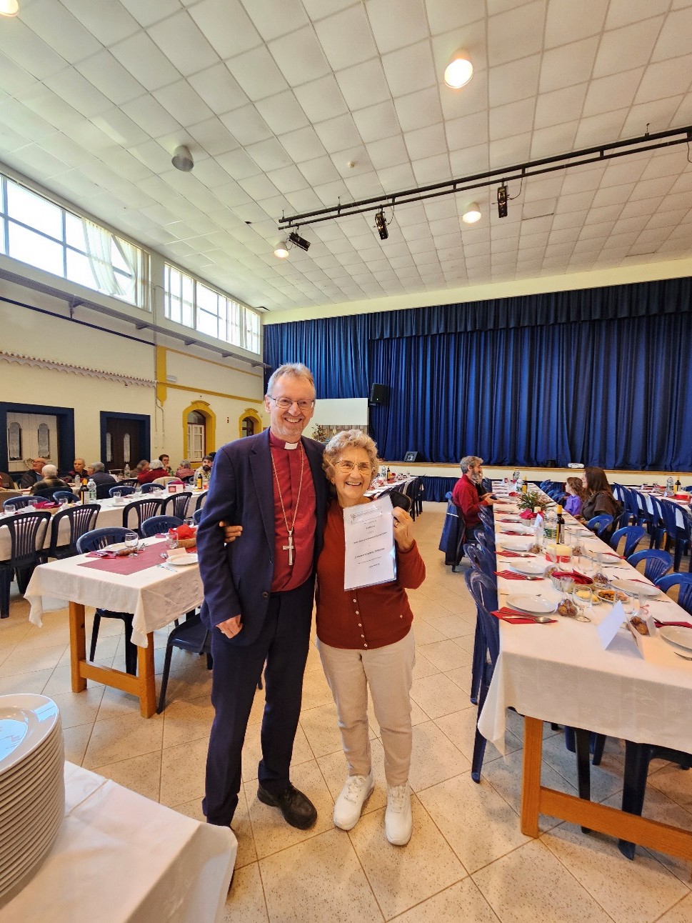 Bishop Robert and a lady in the congregation