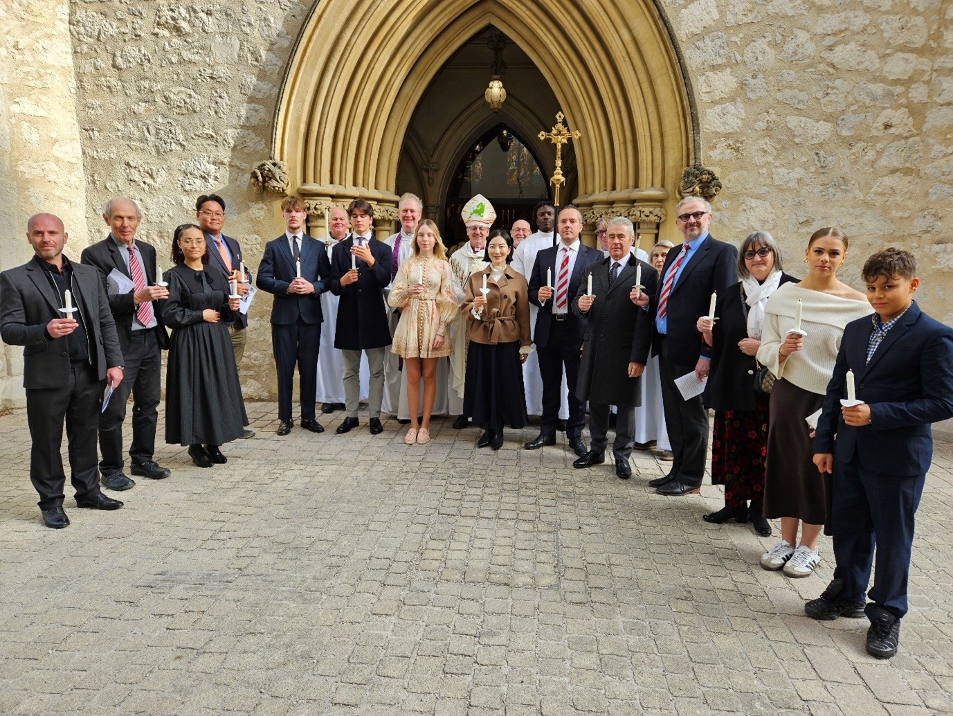 confirmants and bishop outside a church