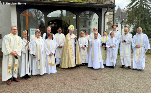 line of clergy outside a church
