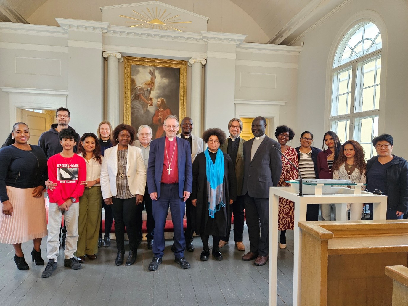 clergy and congregation face camera