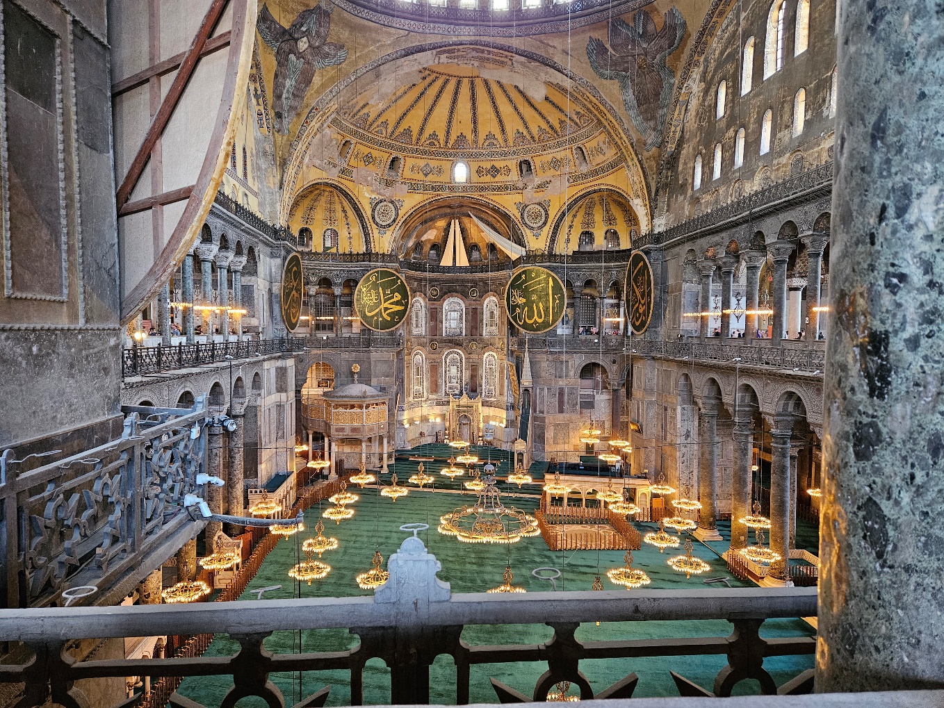 A large ornate building with many arches and a round ceiling
AI-generated content may be incorrect.