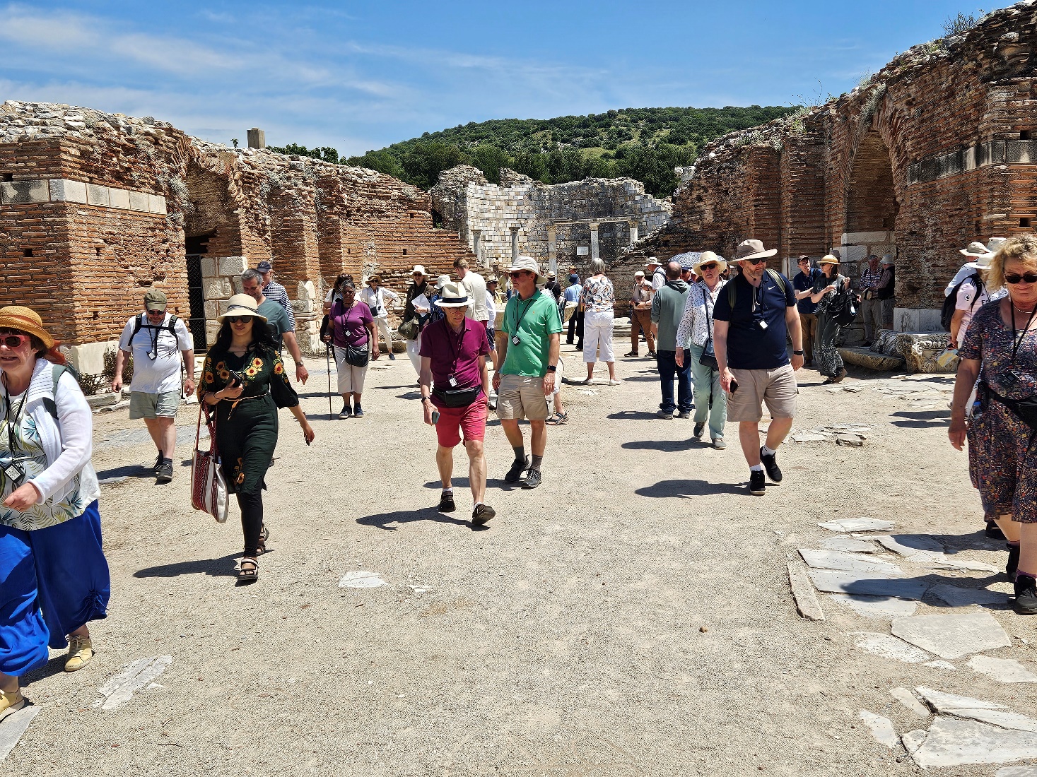 A group of people walking in a stone area
AI-generated content may be incorrect.