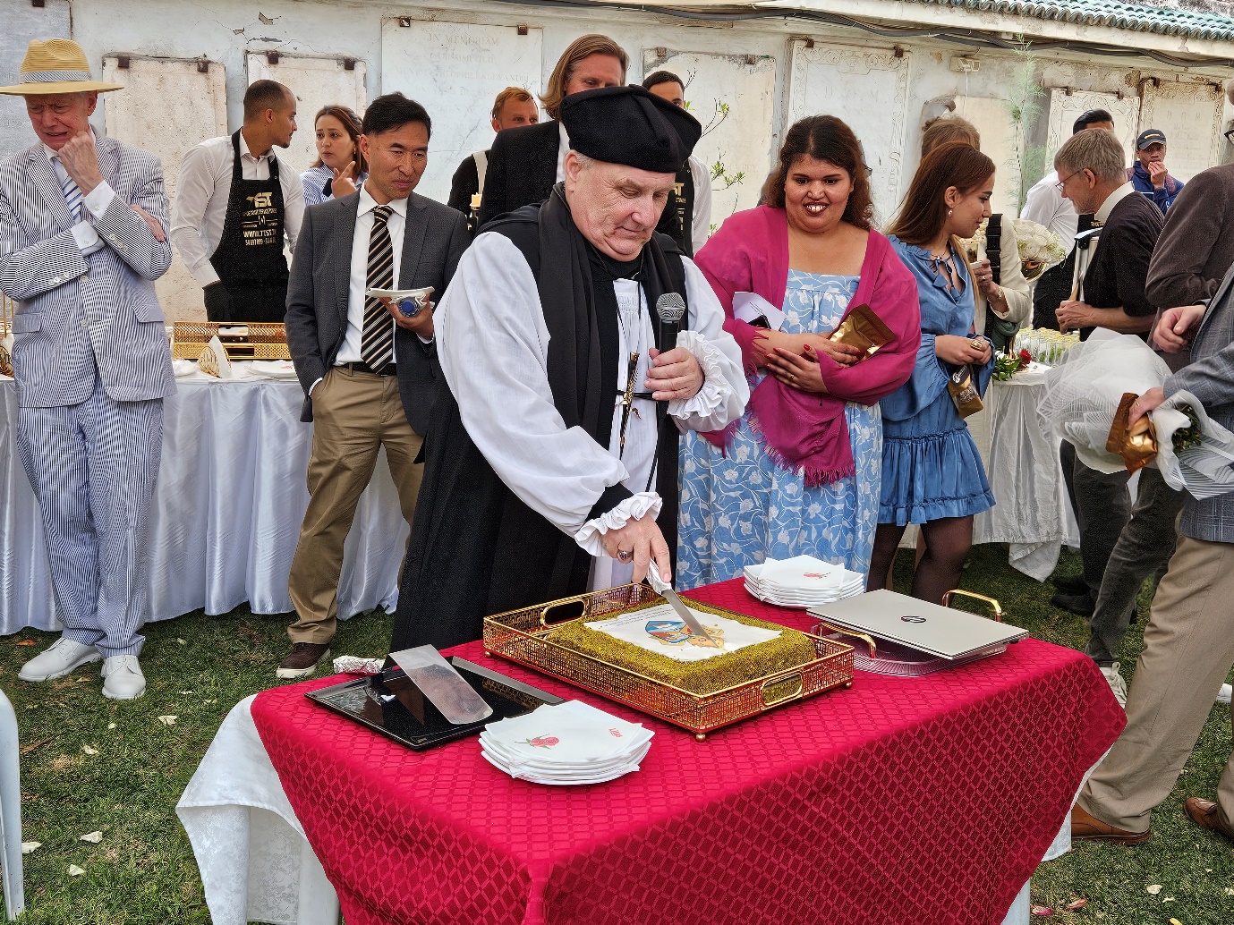 A person cutting a cake
AI-generated content may be incorrect.