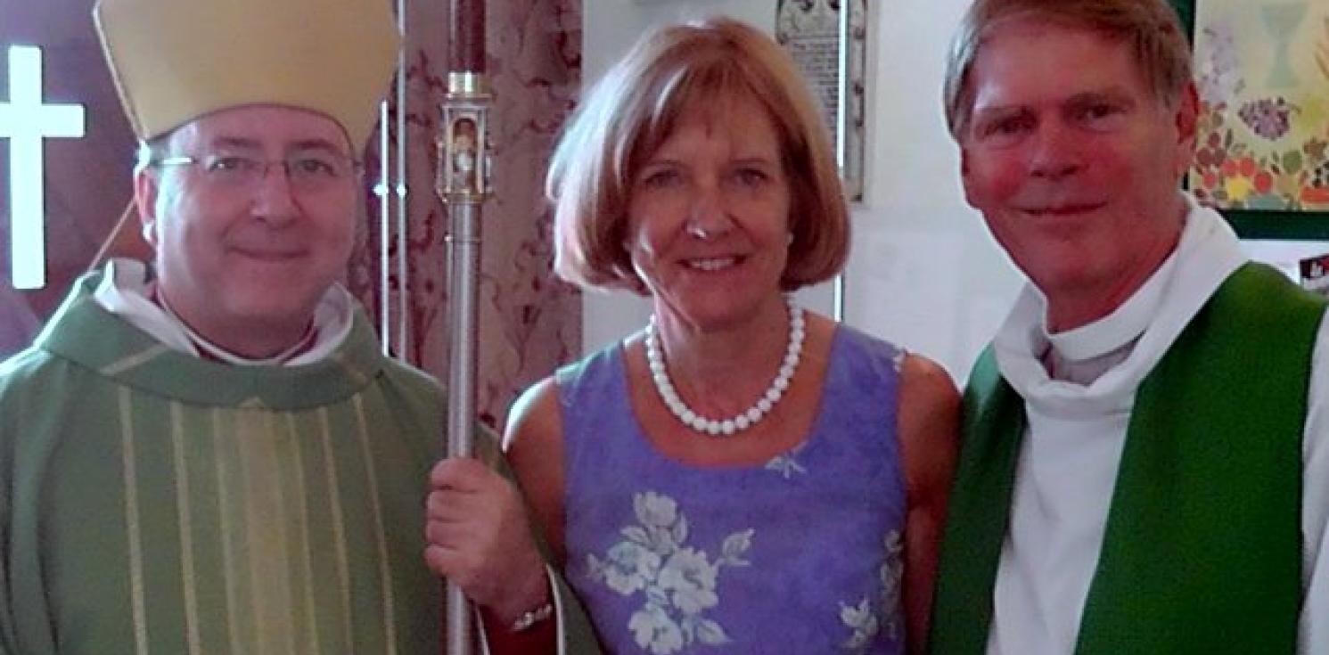 A picture of Reverend Canon Ben Eaton and others.