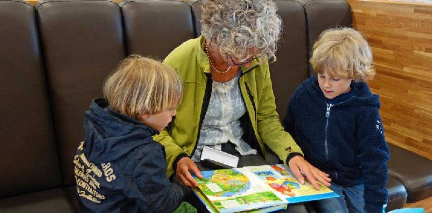 Children being read to from a book.