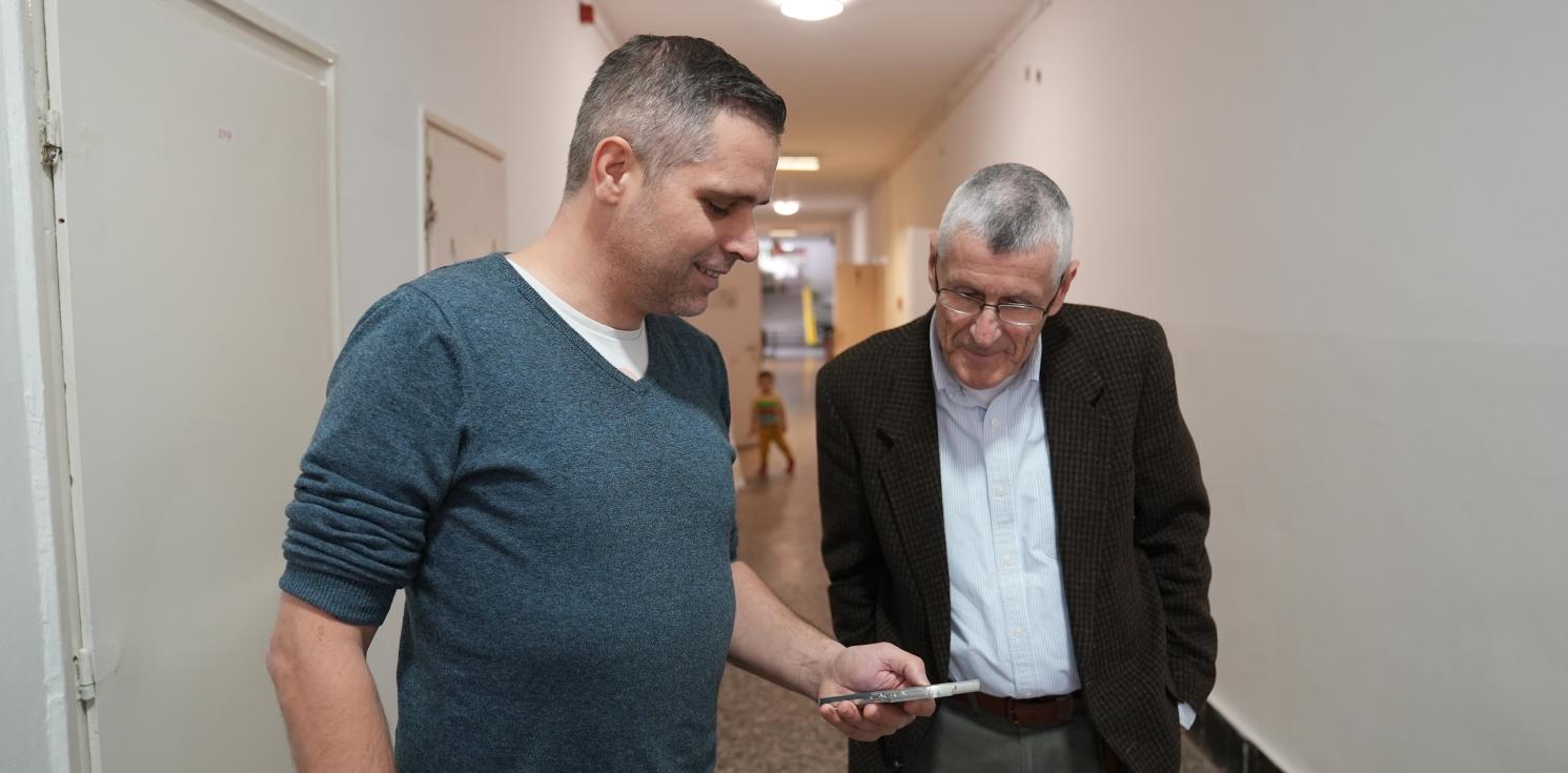 Two men in a refugee center in Budapest.