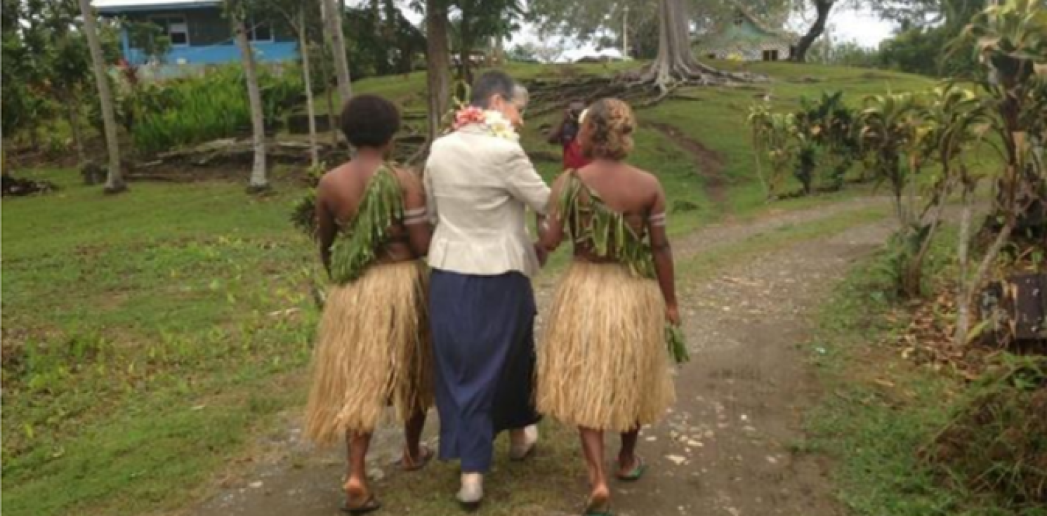 Three women walking together in Tanzania.