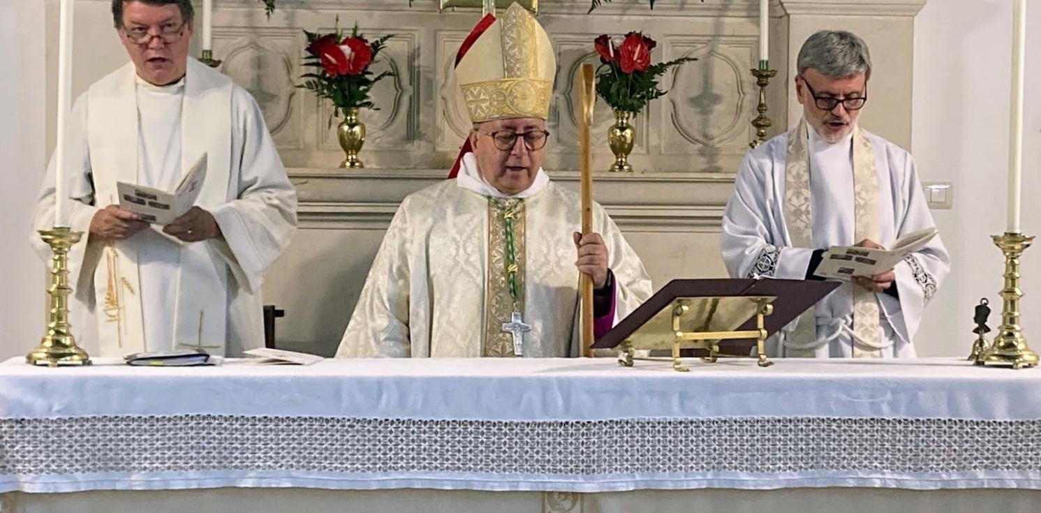 Bishop David reads at the centenary celebrations.