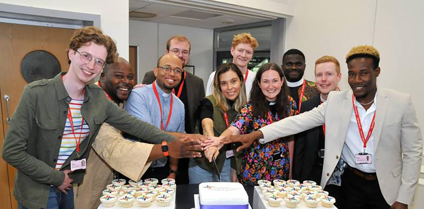 People around a cake