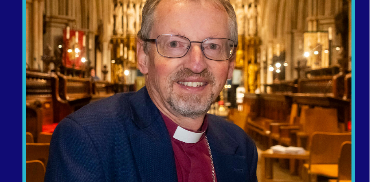 Bishop Robert smiles to camera