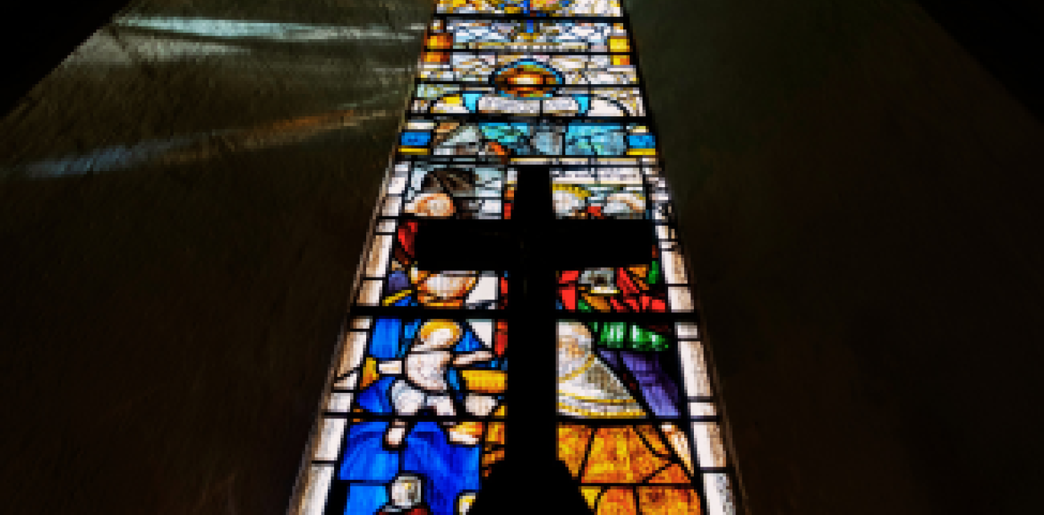 stained glass window and cross