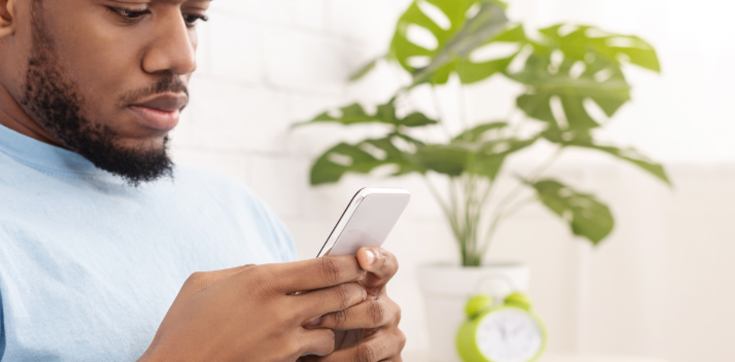 man looking at phone