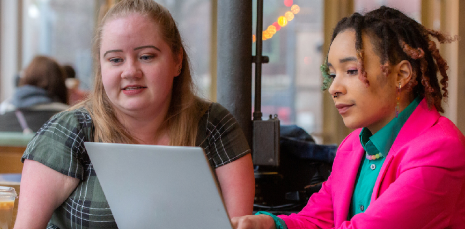 two girls on a laptop
