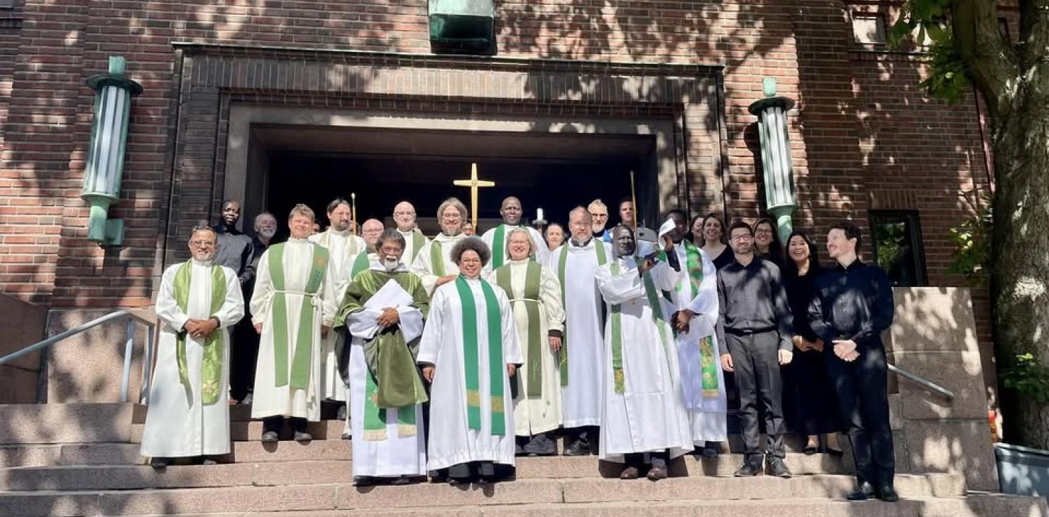 clergy outside a church in finland