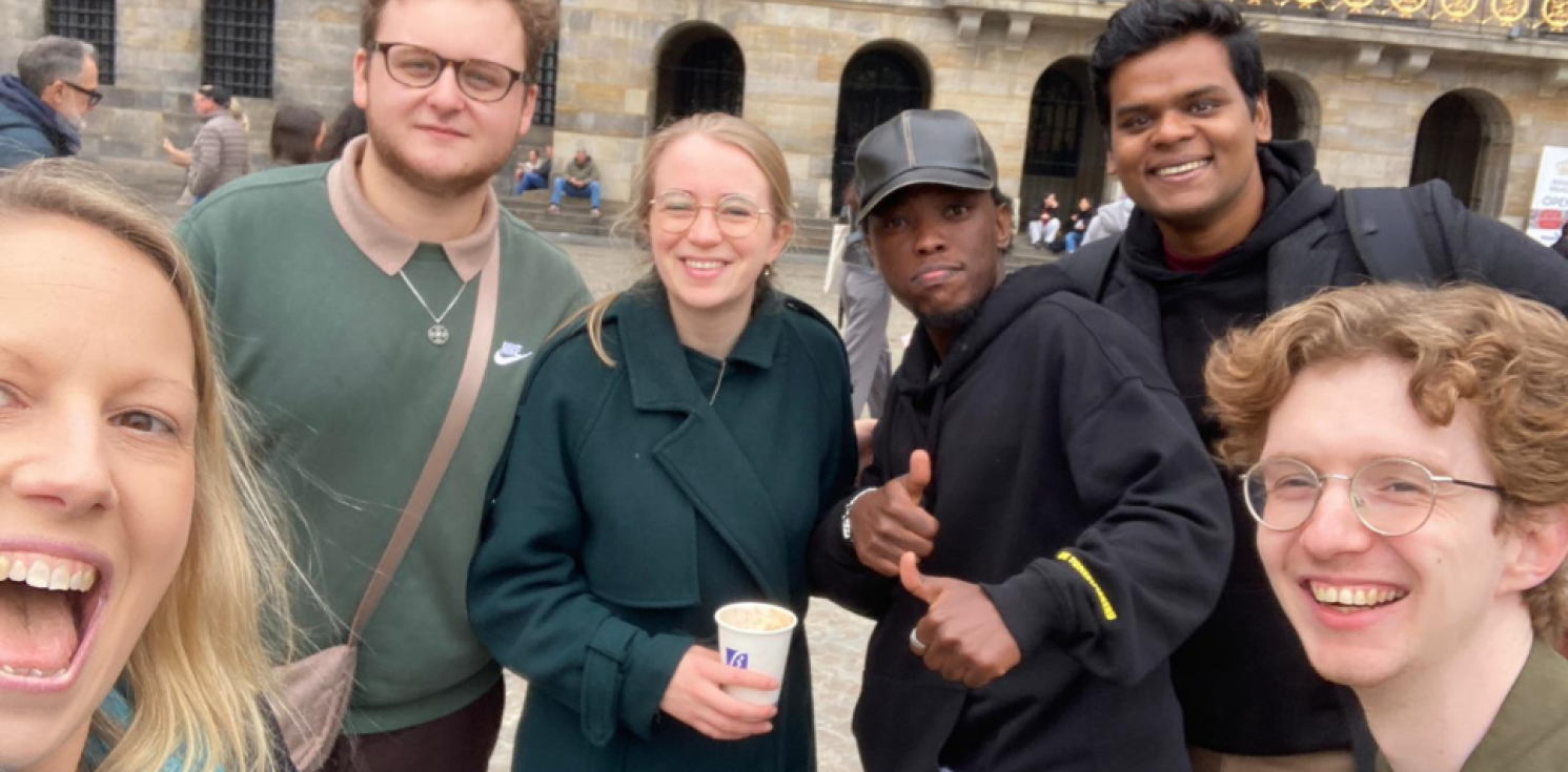 six young people smile to camera