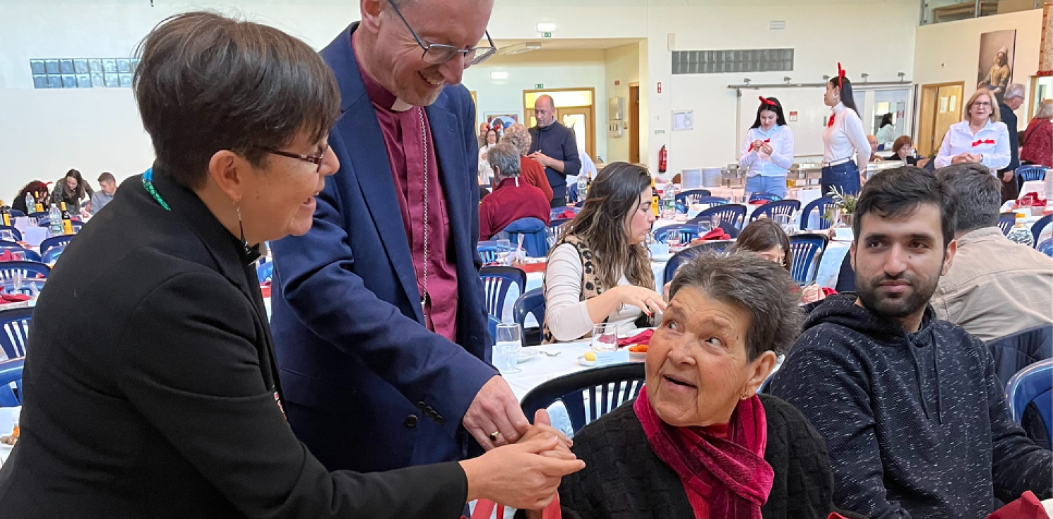 bishop and chaplain talking to an elderly lady