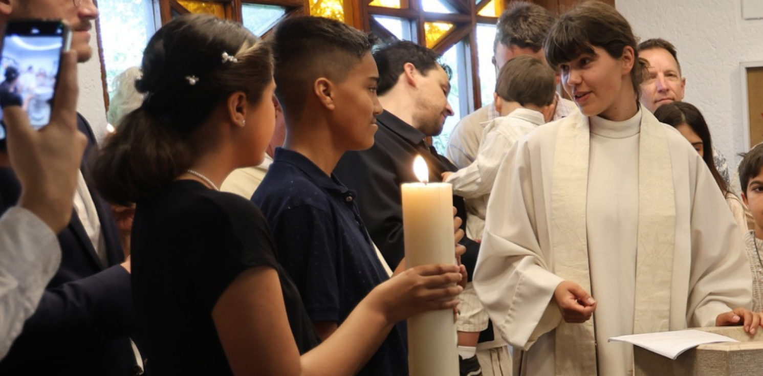 female chaplains talks to two young people