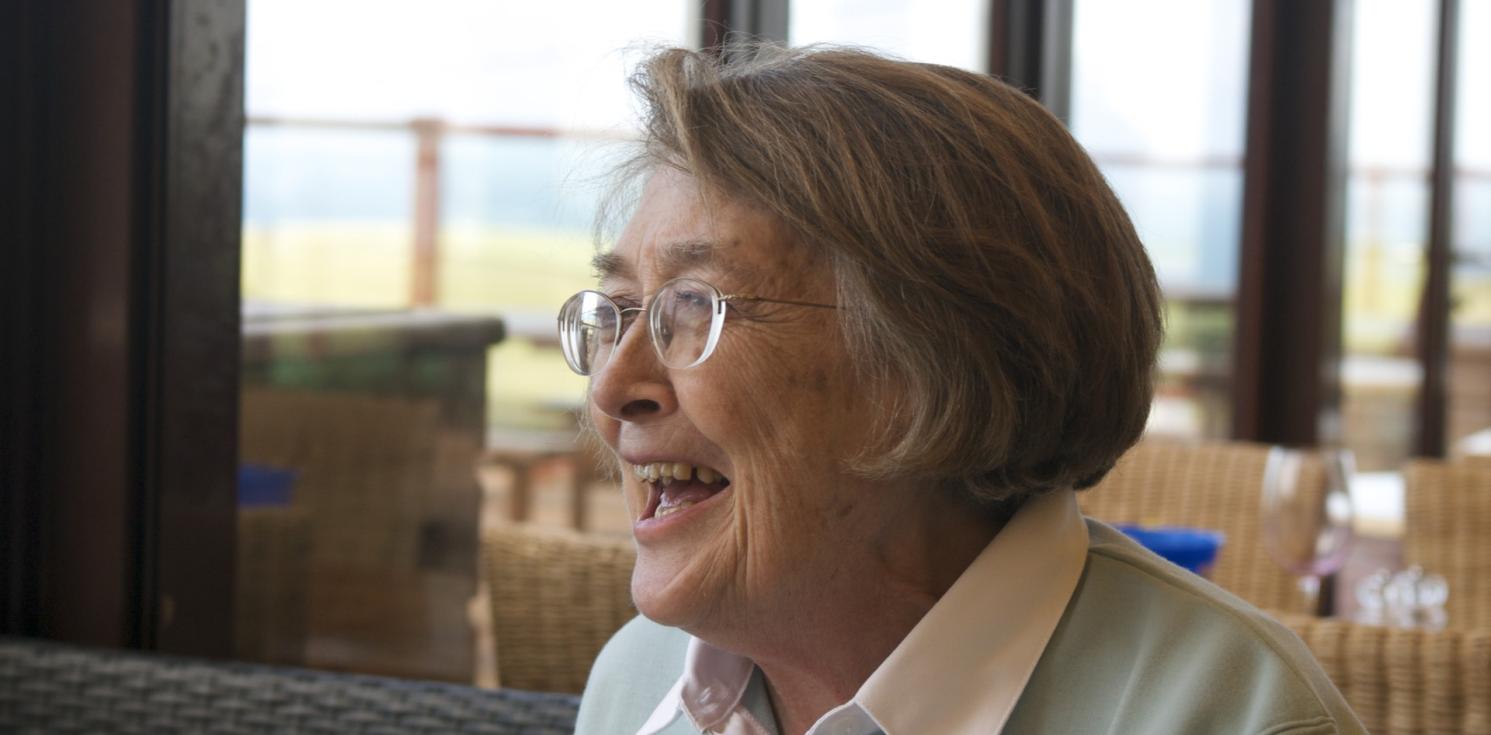 a lady laughs off camera