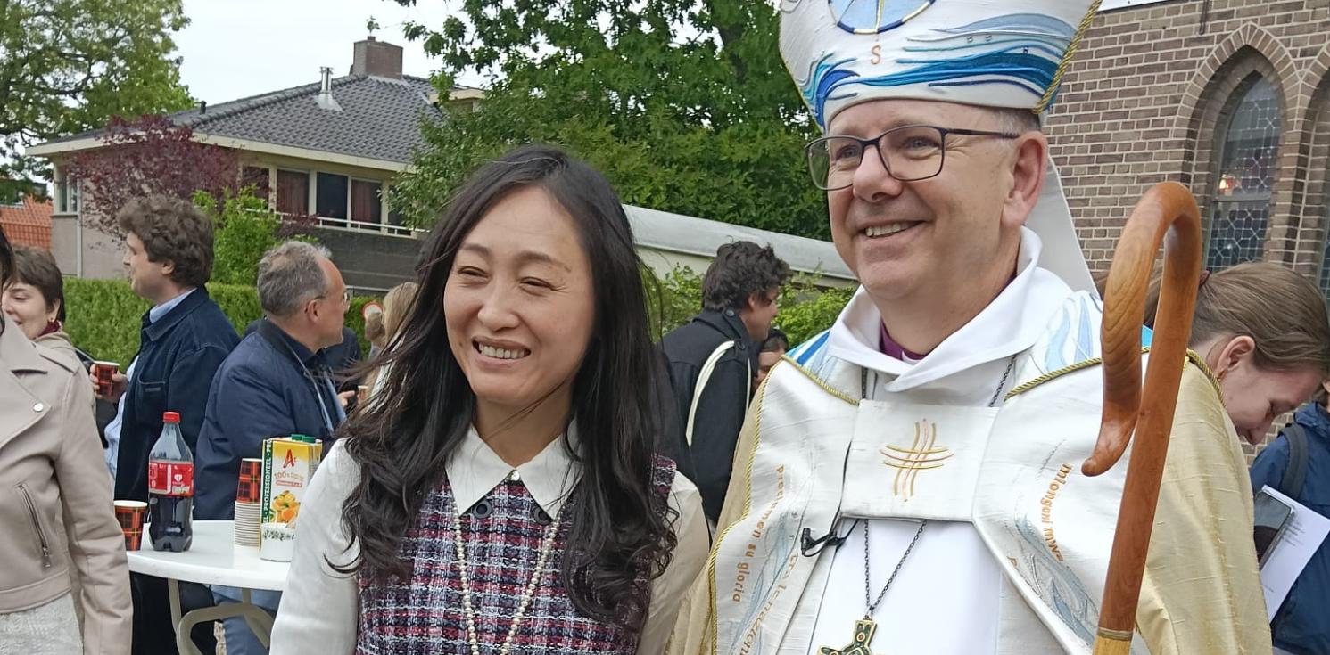 Bishop and confirmand outside church