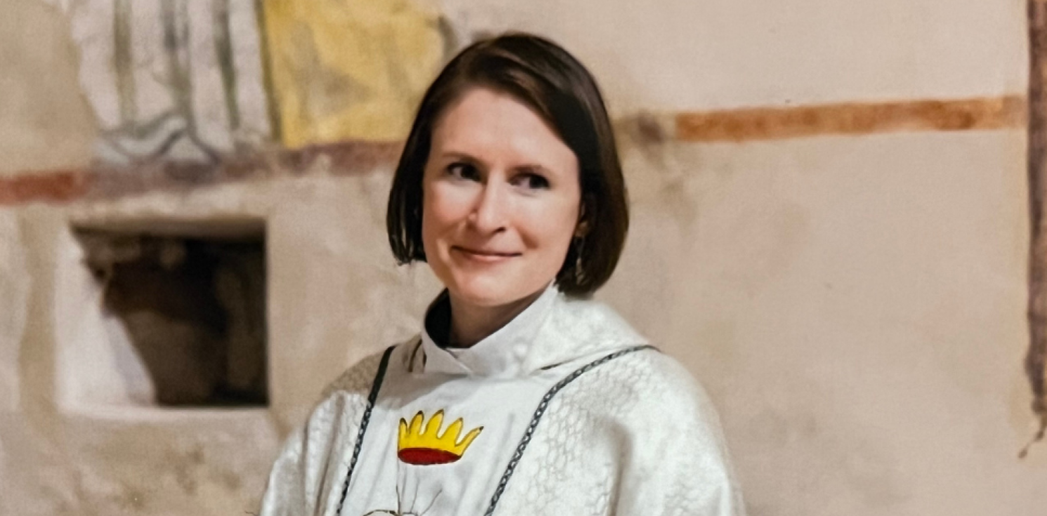 female chaplain smiles