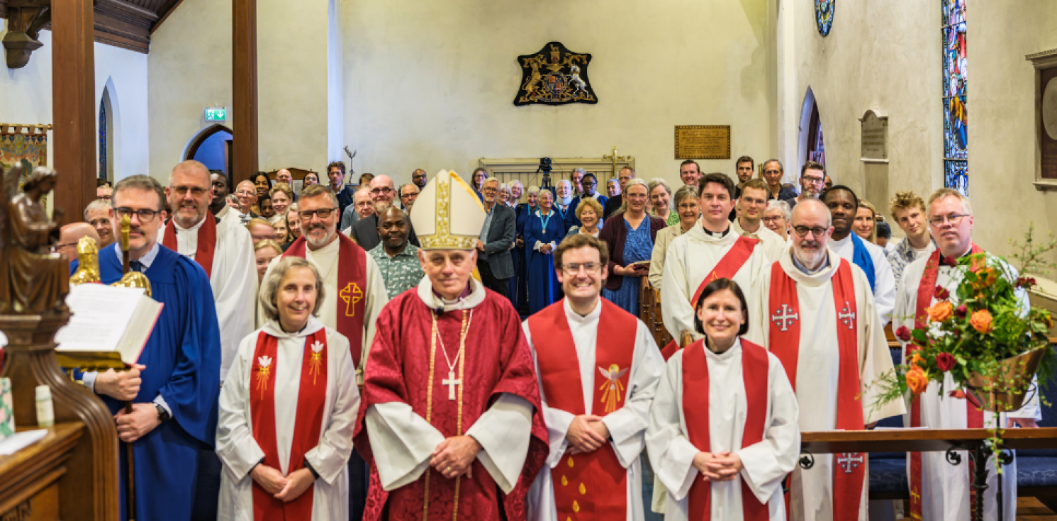 vicars and congregation look to camera