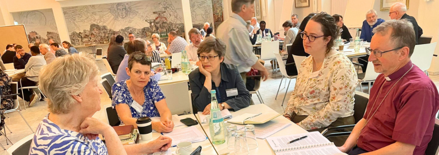 group of people listening to each other round a table