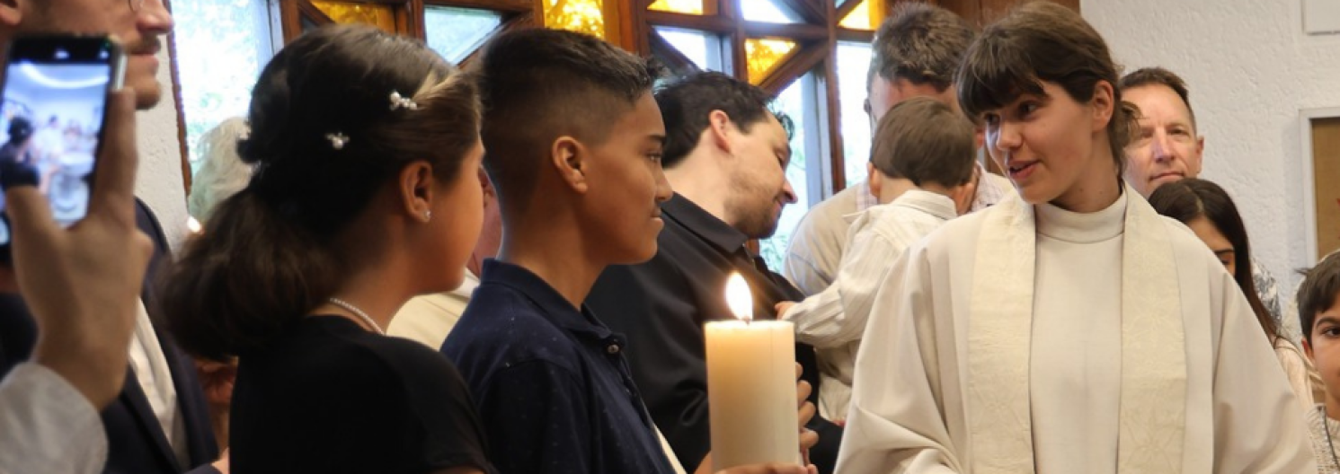 female chaplains talks to two young people